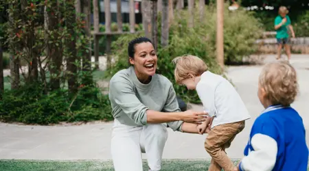 Pedagogical Professional and children at childcare compananny