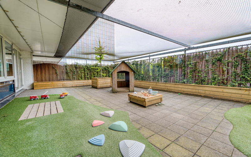 Tuin met grasveld kinderopvang kinderdagverblijf CompaNanny WFC