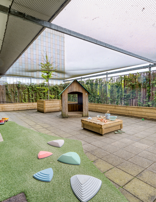 Tuin met grasveld kinderopvang kinderdagverblijf CompaNanny WFC
